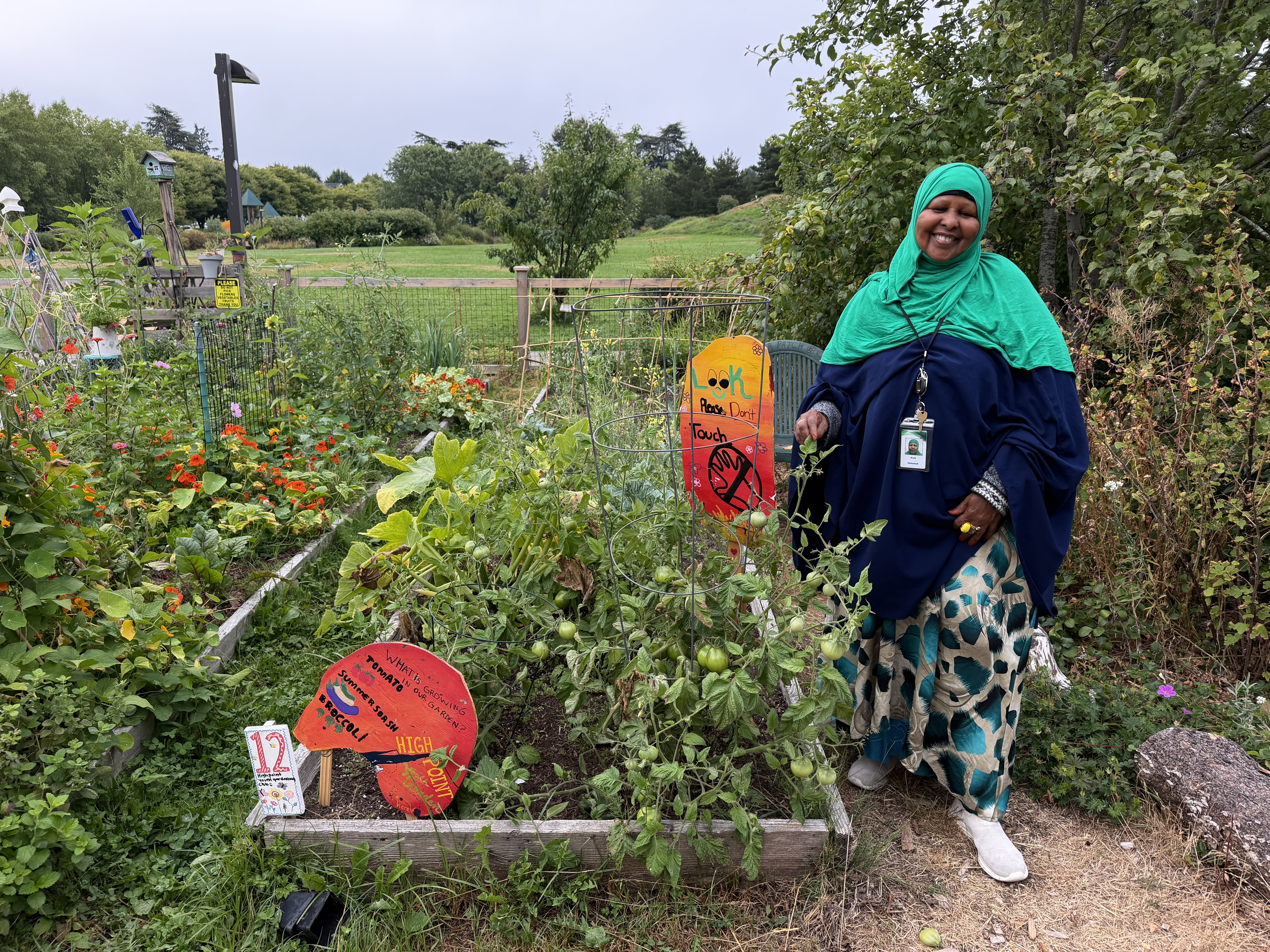 Woman standing in front of a garden